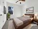 Cozy bedroom with a large bed, modern decor, and a window for natural light at 265 Freeman Pines Pl, Fuquay Varina, NC 27526