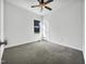 Bright bedroom featuring neutral walls, carpeted floors, and a ceiling fan at 265 Freeman Pines Pl, Fuquay Varina, NC 27526