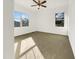 Bright bedroom featuring neutral walls, carpeted floors, and natural light at 265 Freeman Pines Pl, Fuquay Varina, NC 27526