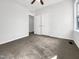 This bedroom features neutral walls, carpeted floors, a ceiling fan, and closet at 265 Freeman Pines Pl, Fuquay Varina, NC 27526