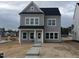 Charming two-story home with gray siding, black roof, and a welcoming front porch at 265 Marvel Dr # 137, Rolesville, NC 27571