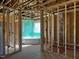 Framed bathroom with window, shower, and tub at 28 Golden View Pl, Zebulon, NC 27597