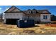 New home with unfinished exterior and dumpster in front at 28 Golden View Pl, Zebulon, NC 27597