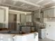 Unfinished kitchen featuring white cabinets, drywall and a corner layout at 28 Golden View Pl, Zebulon, NC 27597