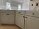 Kitchen with white cabinets and drawers with black knobs at 28 Golden View Pl, Zebulon, NC 27597