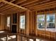 Framed living room with fireplace and many windows at 28 Golden View Pl, Zebulon, NC 27597