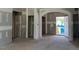 Spacious living room featuring unfinished drywall, and an arched doorway at 28 Golden View Pl, Zebulon, NC 27597