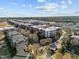 Wide aerial view of a multi-building apartment complex showcasing community layout, landscaping, and surrounding neighborhood at 300 Finsbury St # 313, Durham, NC 27703