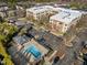 Aerial view of the community pool, apartment buildings, and parking areas, offering a complete lifestyle at 300 Finsbury St # 313, Durham, NC 27703