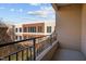 Balcony view overlooking a landscaped courtyard with brick building exterior, offering a private outdoor space at 300 Finsbury St # 313, Durham, NC 27703