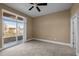 Bedroom includes carpet, a ceiling fan, and access to a private balcony at 300 Finsbury St # 313, Durham, NC 27703