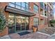 Front entrance to 300 Finsbury features brick, glass doors, and potted plants at 300 Finsbury St # 313, Durham, NC 27703