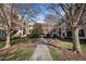 Beautiful courtyard featuring benches, a walkway, and lush green spaces, offering a serene environment at 300 Finsbury St # 313, Durham, NC 27703