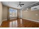 Bright living room with hardwood flooring, large windows, and modern industrial-style exposed ventilation at 300 Finsbury St # 313, Durham, NC 27703