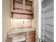 Built-in pantry with granite countertop and upper cabinets, adjacent to a spacious wire-shelved storage area at 300 Finsbury St # 313, Durham, NC 27703