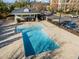 Relaxing community pool featuring a covered area with tables and chairs for residents to enjoy at 300 Finsbury St # 313, Durham, NC 27703