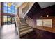 Staircase with sleek metal railings leads to upper floors of the building at 300 Finsbury St # 313, Durham, NC 27703