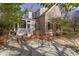 Back exterior of home with patio and screened in porch with mature trees at 300 Mccauley St, Chapel Hill, NC 27516