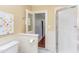 Bathroom with beadboard paneling featuring marble floors, glass shower, and modern toilet at 300 Mccauley St, Chapel Hill, NC 27516