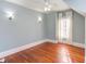 Cozy bedroom with sloped ceilings, hardwood floors, and decorative wall sconces at 300 Mccauley St, Chapel Hill, NC 27516