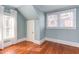 Bright bedroom with hardwood floors, natural light, and a neutral color palette at 300 Mccauley St, Chapel Hill, NC 27516