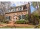 Charming two-story home with mature landscaping, brick entrance, and multiple windows at 300 Mccauley St, Chapel Hill, NC 27516