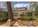 Charming two-story home with a brick path, beautiful landscaping, and multiple windows at 300 Mccauley St, Chapel Hill, NC 27516