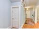 Bright entryway featuring hardwood floors, light blue walls, and a staircase leading to the upper level at 300 Mccauley St, Chapel Hill, NC 27516