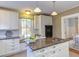 An open concept kitchen boasts a center island, breakfast nook, granite countertops and lots of storage at 300 Mccauley St, Chapel Hill, NC 27516
