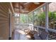 Inviting screened porch featuring a wood ceiling, comfortable seating, and a backyard view at 300 Mccauley St, Chapel Hill, NC 27516