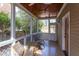 Relaxing screened porch with wood ceiling, comfortable seating, and views of the backyard at 300 Mccauley St, Chapel Hill, NC 27516