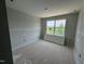 Bedroom with neutral paint, a new window, and a blank canvas for new home owners at 307 Chesapeake Commons St # 100, Garner, NC 27529