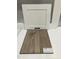 This photo showcases white cabinetry paired with luxury vinyl flooring at 307 Chesapeake Commons St # 100, Garner, NC 27529