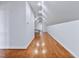 Finished attic space with hardwood floors, neutral paint, and recessed lighting creating a versatile bonus area at 309 Shoreline Dr, Princeton, NC 27569