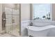 Chic bathroom features a freestanding tub, a glass-enclosed shower and stylish accents at 309 Shoreline Dr, Princeton, NC 27569