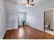 Bright bedroom featuring hardwood floors and an en-suite bathroom at 309 Shoreline Dr, Princeton, NC 27569