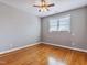 Cozy bedroom features natural light, hardwood floors, and neutral paint perfect for relaxation and comfort at 309 Shoreline Dr, Princeton, NC 27569