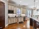 Open concept kitchen with custom cabinets, granite countertops, and hardwood floors at 309 Shoreline Dr, Princeton, NC 27569