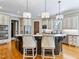 Kitchen with custom cabinets, hardwood floors, granite countertops, and stainless steel appliances at 309 Shoreline Dr, Princeton, NC 27569