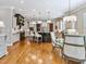 Kitchen and dining area with hardwood floors, custom cabinets, granite countertops, and stainless appliances at 309 Shoreline Dr, Princeton, NC 27569