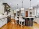 Spacious kitchen featuring modern appliances, a dark wood island, and custom cabinetry at 309 Shoreline Dr, Princeton, NC 27569