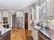 View of kitchen area featuring modern stainless-steel appliances and granite countertops at 309 Shoreline Dr, Princeton, NC 27569