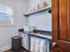 Well-organized laundry room featuring ample counter space, storage cabinets, and convenient laundry bins at 309 Shoreline Dr, Princeton, NC 27569