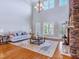 Spacious living room with a stone fireplace, hardwood floors, and natural light at 309 Shoreline Dr, Princeton, NC 27569