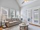 Living room with natural light, hardwood floors, neutral paint, and casual seating at 309 Shoreline Dr, Princeton, NC 27569