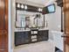 Luxurious main bathroom featuring a double vanity, elegant mirrors, and a clean design at 309 Shoreline Dr, Princeton, NC 27569