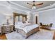 Beautiful main bedroom featuring an ornate bed, stylish bedside tables and a ceiling fan at 309 Shoreline Dr, Princeton, NC 27569