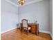 Inviting home office features a classic desk with intricate detailing and hardwood flooring at 309 Shoreline Dr, Princeton, NC 27569