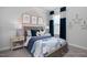 Charming bedroom with accent wall, whimsical decor, and ample natural light at 31 Priming Way, Angier, NC 27501