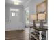 Welcoming entryway with stylish table lamps, a decorative table, and beautiful hardwood floors at 31 Priming Way, Angier, NC 27501